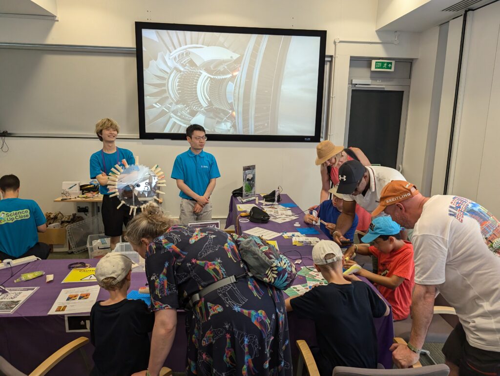 Visitors having making their own designs using 3D printing pens